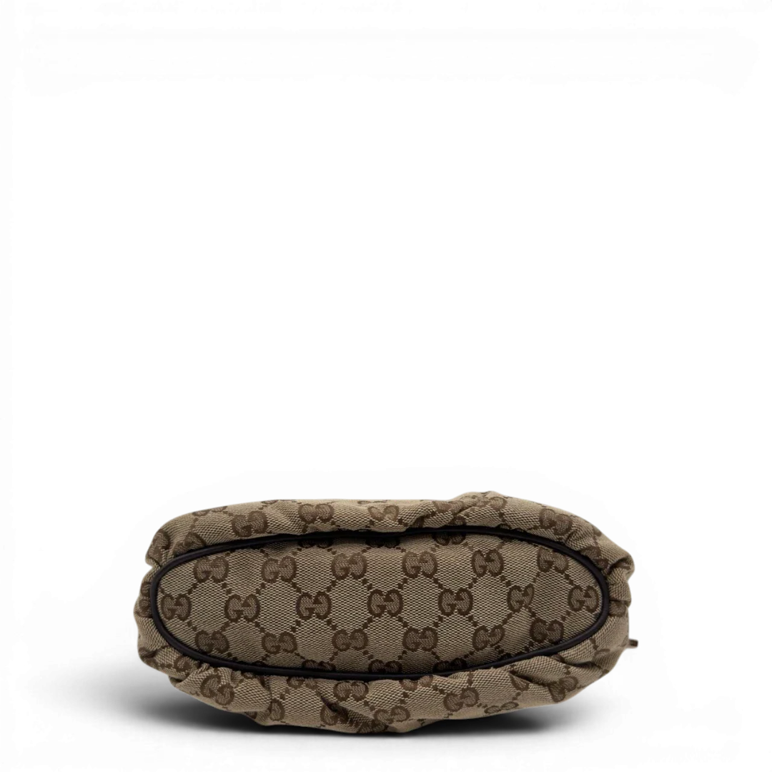 https://cdn.shopify.com/s/files/1/0564/9376/8855/files/Gucci_Pochette_Sherry_Line_monogram_beige_5.webp?v=1784281813
