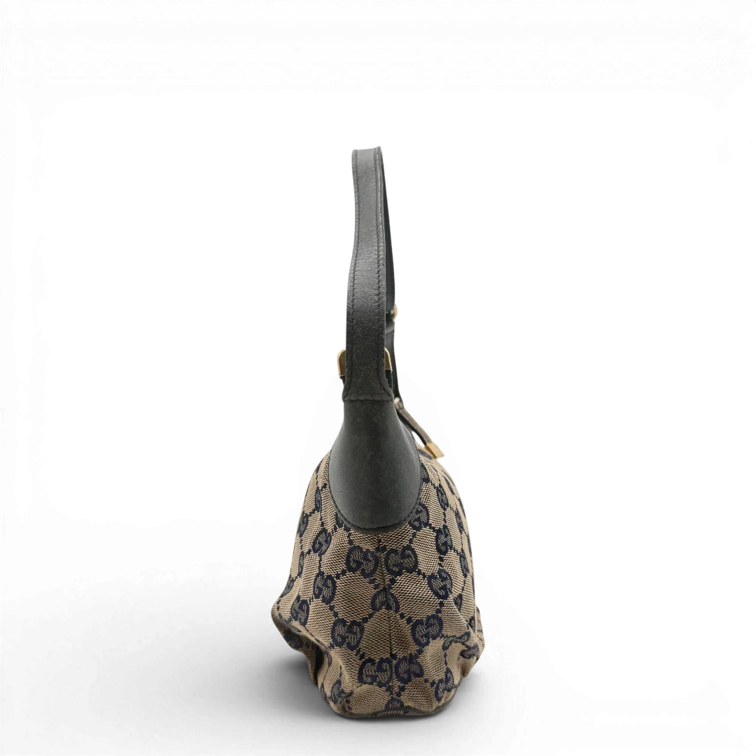 https://cdn.shopify.com/s/files/1/0564/9376/8855/files/Gucci_Pochette_Sherry_Line_monogram_beige_vintage_GG6080_7802b21e-18b8-4e55-a43c-bb663ea544d0.webp?v=1778198706