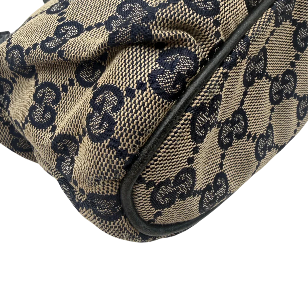 https://cdn.shopify.com/s/files/1/0564/9376/8855/files/Gucci_Pochette_Sherry_Line_monogram_beige_vintage_GG6083_1095b5f3-0cf4-4463-9a63-2f4699680e44.webp?v=1778198707