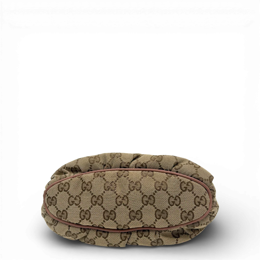 https://cdn.shopify.com/s/files/1/0564/9376/8855/files/Gucci_Pochette_Sherry_Line_monogram_beige_vintage_GG_0075.webp?v=1771500976