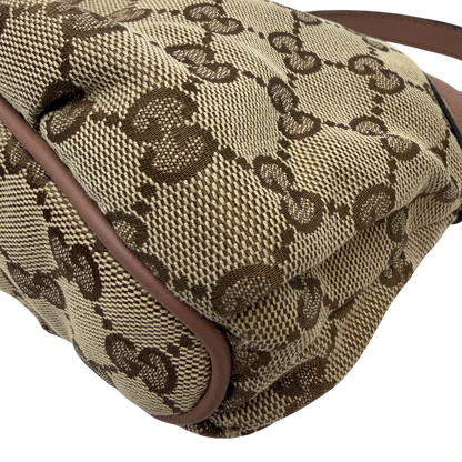 https://cdn.shopify.com/s/files/1/0564/9376/8855/files/Gucci_Pochette_Sherry_Line_monogram_beige_vintage_GG_0076.webp?v=1771500976