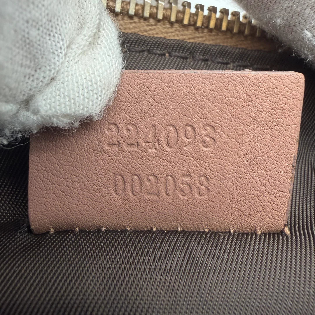 https://cdn.shopify.com/s/files/1/0564/9376/8855/files/Gucci_Pochette_Sherry_Line_monogram_beige_vintage_GG_0086.webp?v=1771500976