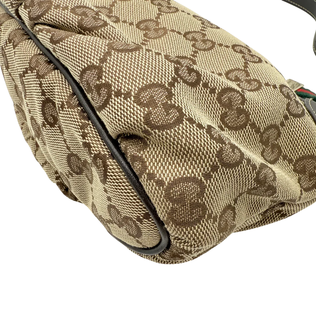 https://cdn.shopify.com/s/files/1/0564/9376/8855/files/Gucci_Pochette_Sherry_Line_monogram_beige_vintage_GG_1481.webp?v=1771406559