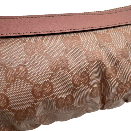 https://cdn.shopify.com/s/files/1/0564/9376/8855/files/Gucci_Pochette_mit_GG_Anhanger_PVC_monogram_rosa_vintage_GG1760.webp?v=1779407744