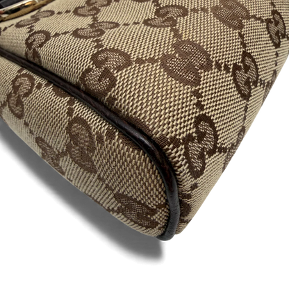 https://cdn.shopify.com/s/files/1/0564/9376/8855/files/Gucci_Pochette_monogram_braun_vintage_GG3560.webp?v=1764857398