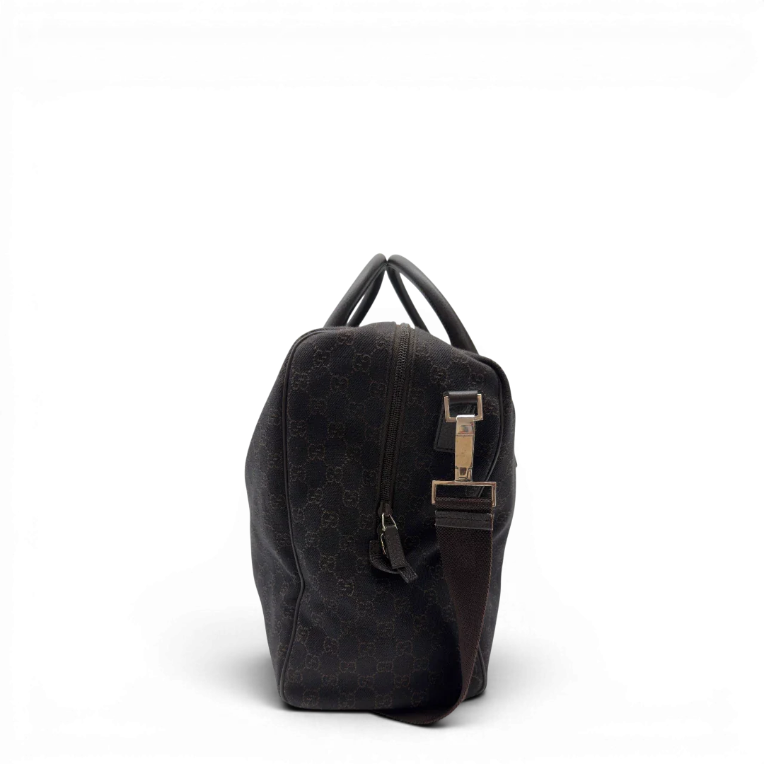 https://cdn.shopify.com/s/files/1/0564/9376/8855/files/Gucci_Reisetasche_50_mit_Umhangegurt_monogram_dunkelbraun_2.webp?v=1782904192