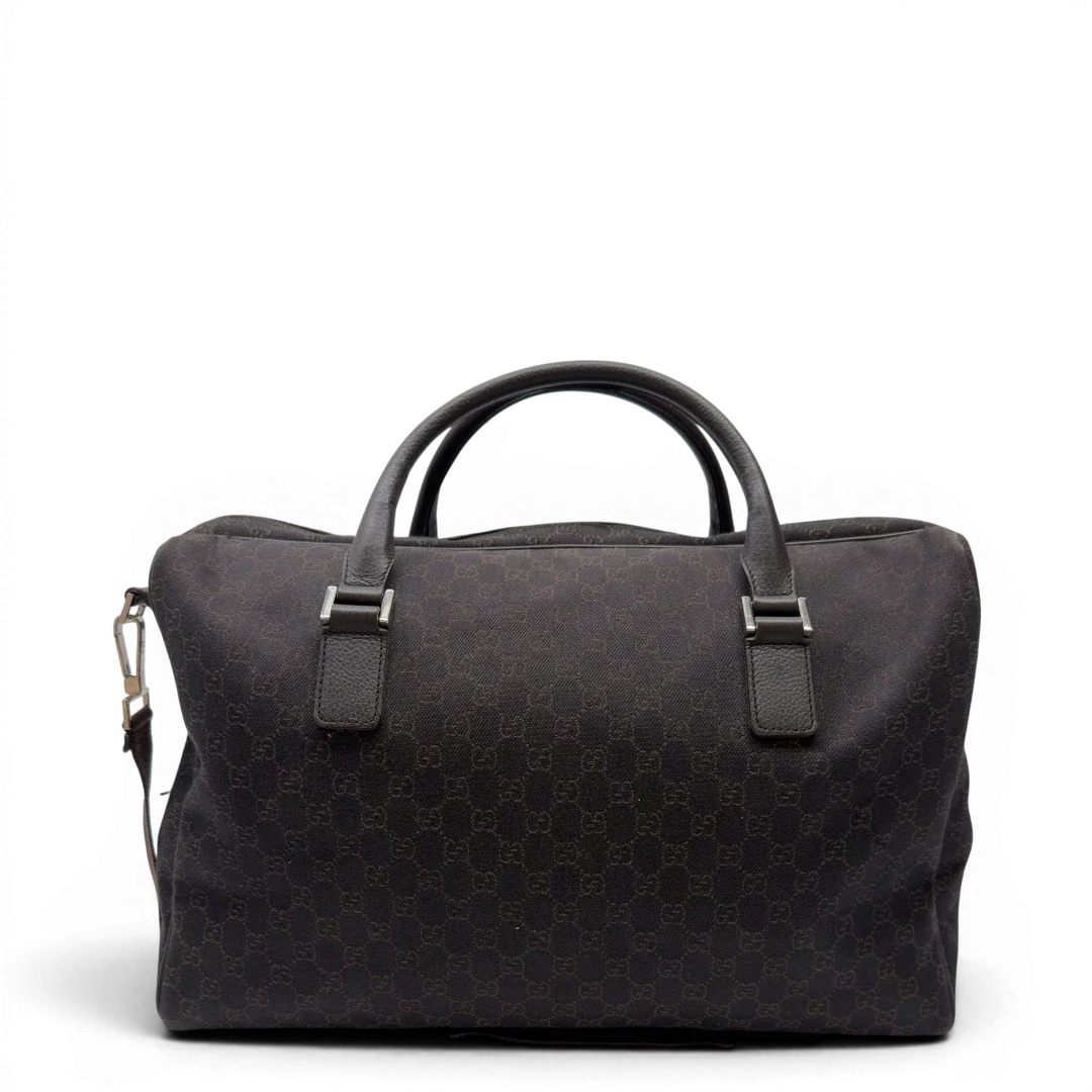 https://cdn.shopify.com/s/files/1/0564/9376/8855/files/Gucci_Reisetasche_50_mit_Umhangegurt_monogram_dunkelbraun_4.webp?v=1782904192