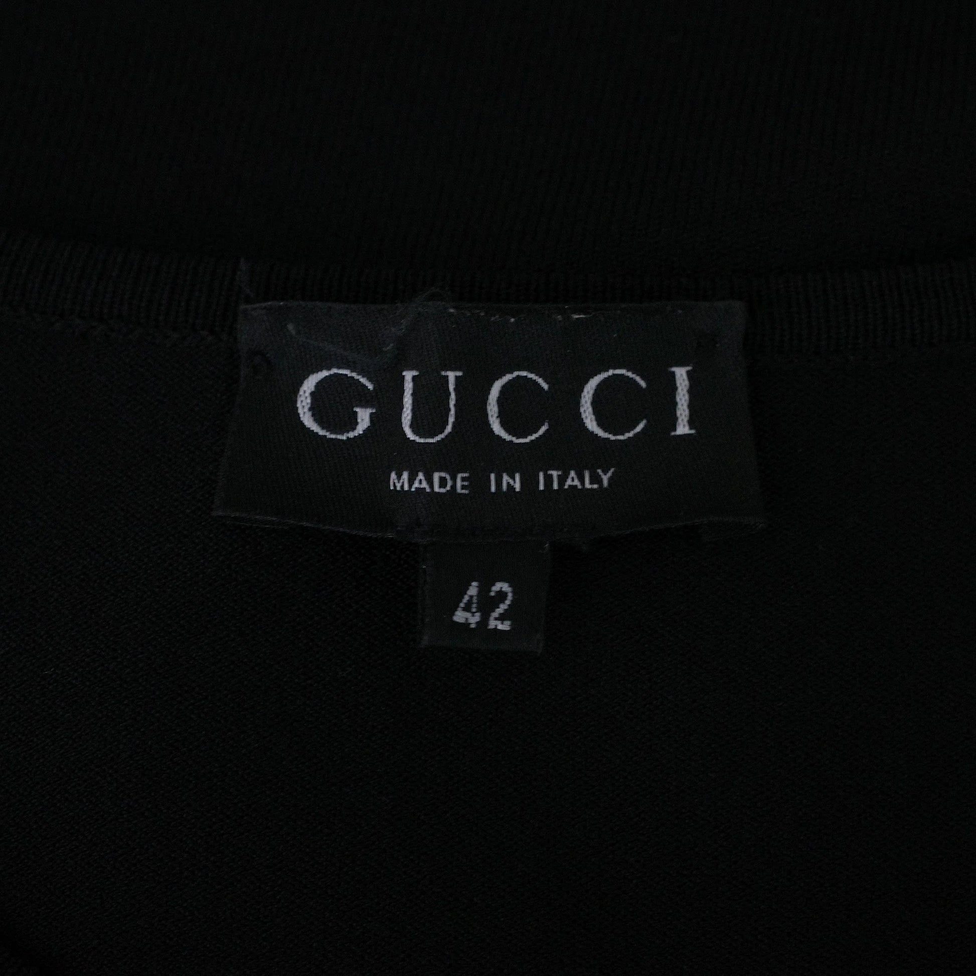 Gucci by Tom Ford SS 1998 viscose knit short sleeve top with a sleeve cutout featuring an engraved metal plate. Size IT 42 / UK 8-10.
