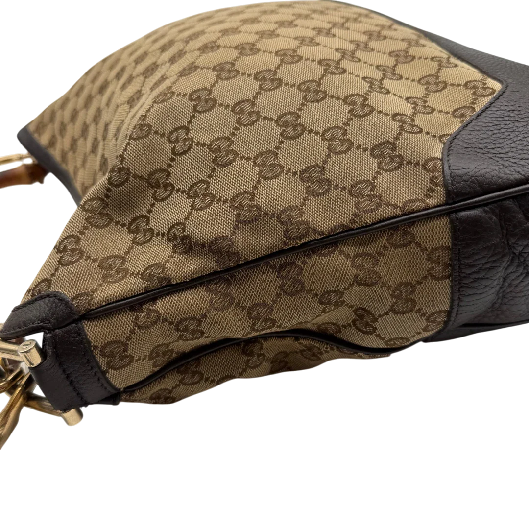 https://cdn.shopify.com/s/files/1/0564/9376/8855/files/Gucci_Schultertasche_Bamboo_mit_Umhangegurt_monogram_beige_15.webp?v=1781855073