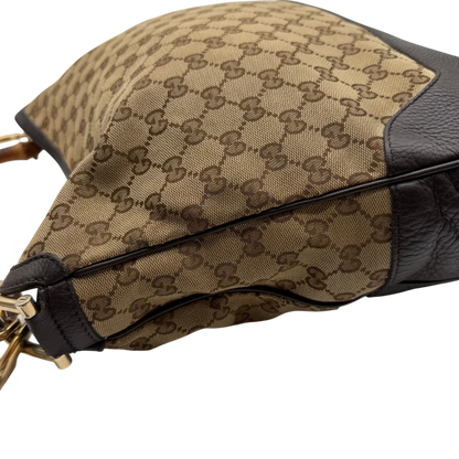 https://cdn.shopify.com/s/files/1/0564/9376/8855/files/Gucci_Schultertasche_Bamboo_mit_Umhangegurt_monogram_beige_15.webp?v=1781855073