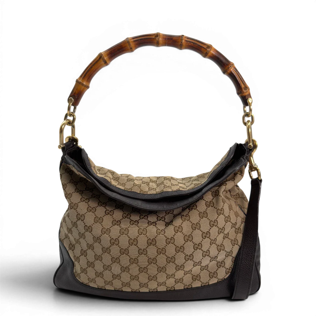 https://cdn.shopify.com/s/files/1/0564/9376/8855/files/Gucci_Schultertasche_Bamboo_mit_Umhangegurt_monogram_beige_vintage_GG8739.webp?v=1781083017