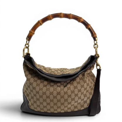 https://cdn.shopify.com/s/files/1/0564/9376/8855/files/Gucci_Schultertasche_Bamboo_mit_Umhangegurt_monogram_beige_vintage_GG8739.webp?v=1781083017