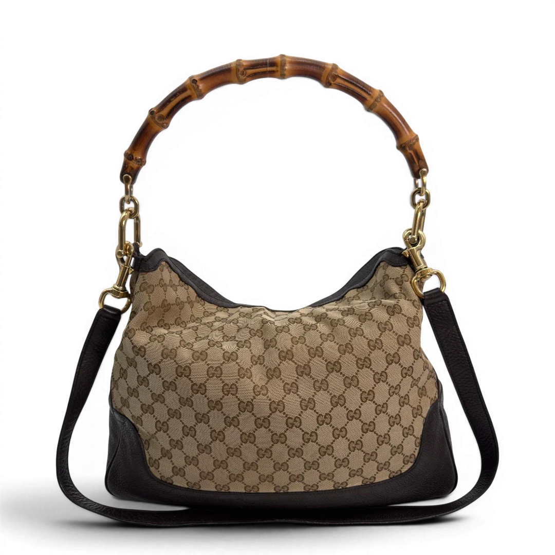 https://cdn.shopify.com/s/files/1/0564/9376/8855/files/Gucci_Schultertasche_Bamboo_mit_Umhangegurt_monogram_beige_vintage_GG8740.webp?v=1781083017