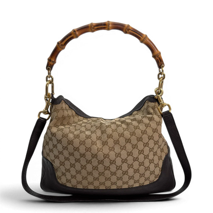https://cdn.shopify.com/s/files/1/0564/9376/8855/files/Gucci_Schultertasche_Bamboo_mit_Umhangegurt_monogram_beige_vintage_GG8740.webp?v=1781083017