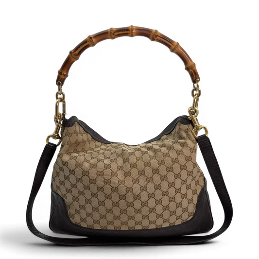 https://cdn.shopify.com/s/files/1/0564/9376/8855/files/Gucci_Schultertasche_Bamboo_mit_Umhangegurt_monogram_beige_vintage_GG8740.webp?v=1781083017