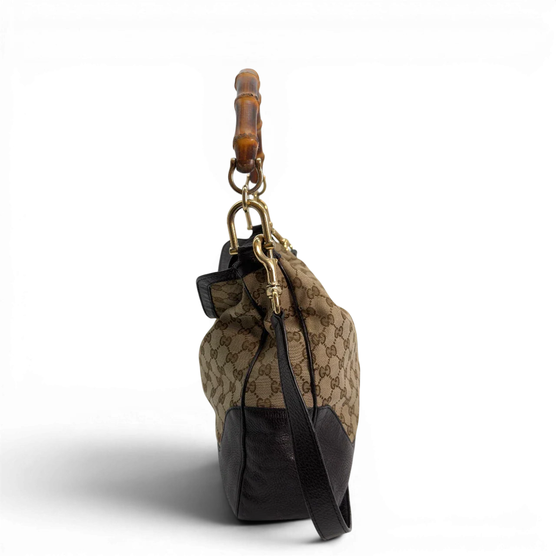 https://cdn.shopify.com/s/files/1/0564/9376/8855/files/Gucci_Schultertasche_Bamboo_mit_Umhangegurt_monogram_beige_vintage_GG8742.webp?v=1781083017