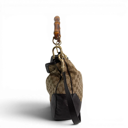 https://cdn.shopify.com/s/files/1/0564/9376/8855/files/Gucci_Schultertasche_Bamboo_mit_Umhangegurt_monogram_beige_vintage_GG8742.webp?v=1781083017