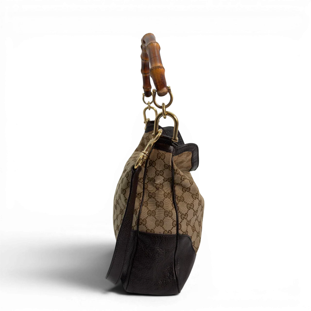 https://cdn.shopify.com/s/files/1/0564/9376/8855/files/Gucci_Schultertasche_Bamboo_mit_Umhangegurt_monogram_beige_vintage_GG8743.webp?v=1781083017