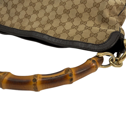 https://cdn.shopify.com/s/files/1/0564/9376/8855/files/Gucci_Schultertasche_Bamboo_mit_Umhangegurt_monogram_beige_vintage_GG8752.webp?v=1781083017