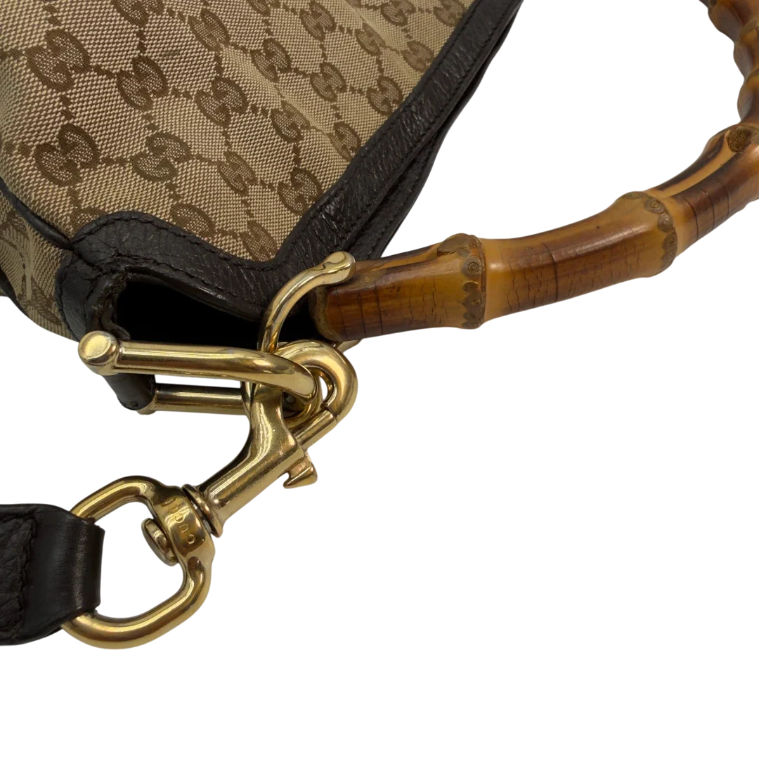 https://cdn.shopify.com/s/files/1/0564/9376/8855/files/Gucci_Schultertasche_Bamboo_mit_Umhangegurt_monogram_beige_vintage_GG8753.webp?v=1781083017