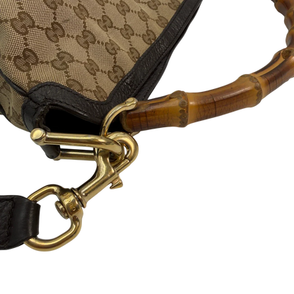 https://cdn.shopify.com/s/files/1/0564/9376/8855/files/Gucci_Schultertasche_Bamboo_mit_Umhangegurt_monogram_beige_vintage_GG8753.webp?v=1781083017