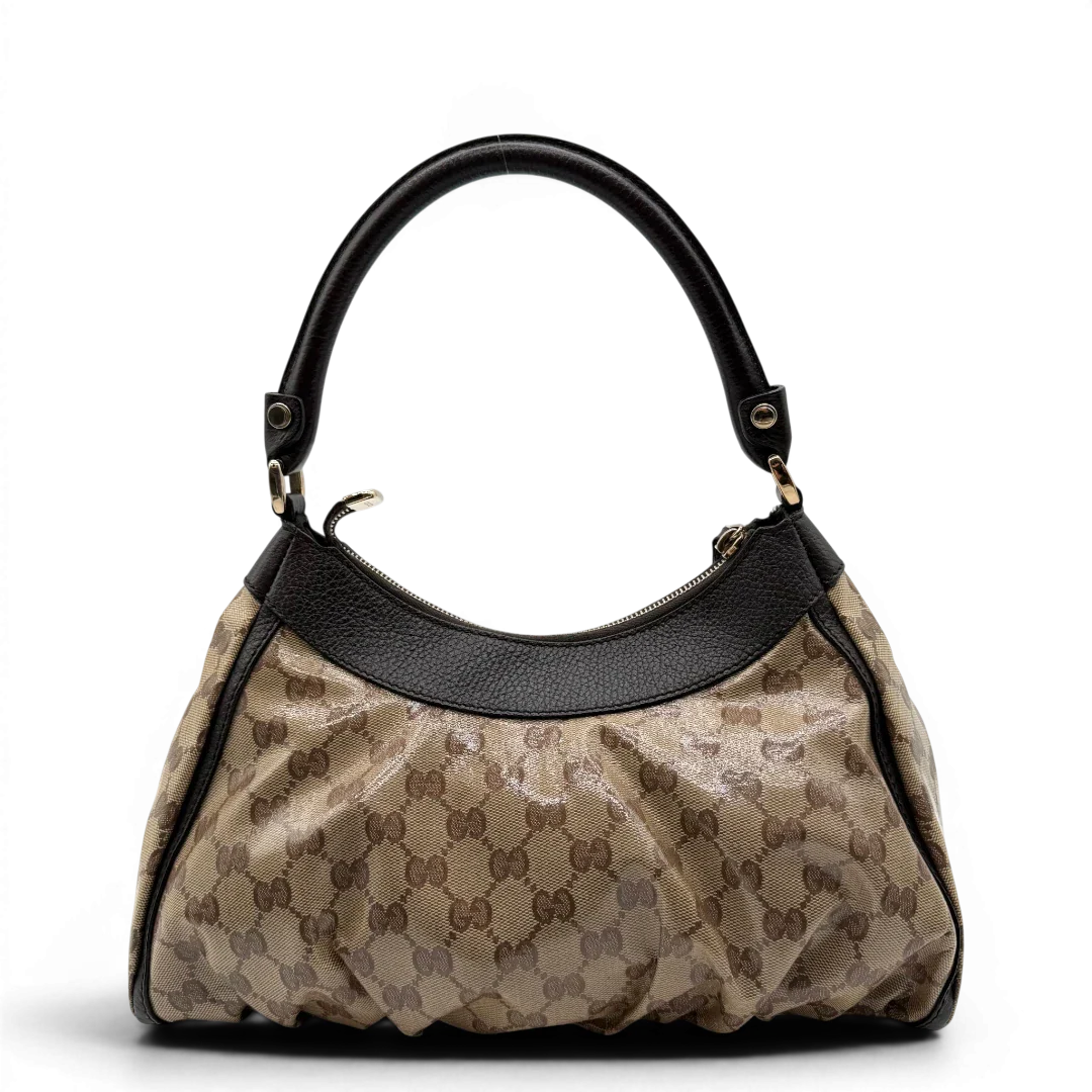 https://cdn.shopify.com/s/files/1/0564/9376/8855/files/Gucci_Schultertasche_D-Ring_PVC_monogram_beige_vintage_GG6242.webp?v=1778680147