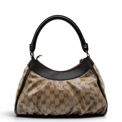 https://cdn.shopify.com/s/files/1/0564/9376/8855/files/Gucci_Schultertasche_D-Ring_PVC_monogram_beige_vintage_GG6242.webp?v=1778680147