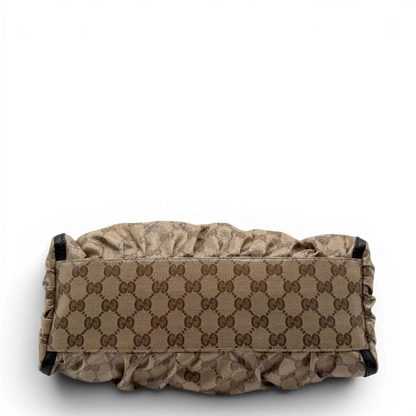 https://cdn.shopify.com/s/files/1/0564/9376/8855/files/Gucci_Schultertasche_D-Ring_PVC_monogram_beige_vintage_GG6245.webp?v=1778680147