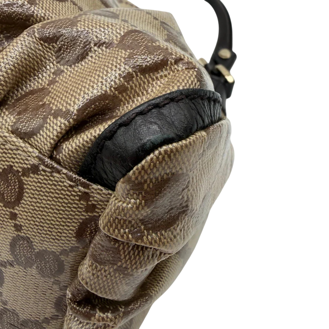 https://cdn.shopify.com/s/files/1/0564/9376/8855/files/Gucci_Schultertasche_D-Ring_PVC_monogram_beige_vintage_GG6247.webp?v=1778680147