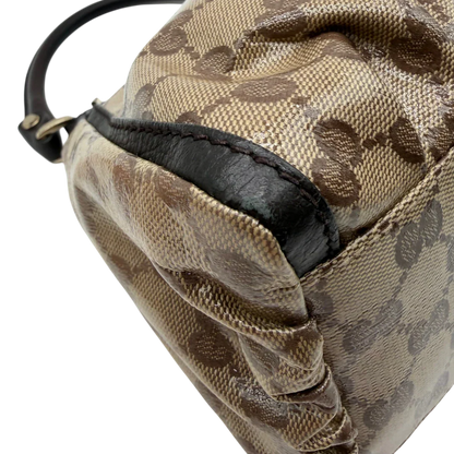 https://cdn.shopify.com/s/files/1/0564/9376/8855/files/Gucci_Schultertasche_D-Ring_PVC_monogram_beige_vintage_GG6249.webp?v=1778680147