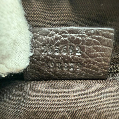 https://cdn.shopify.com/s/files/1/0564/9376/8855/files/Gucci_Schultertasche_D-Ring_PVC_monogram_beige_vintage_GG6257.webp?v=1778680147