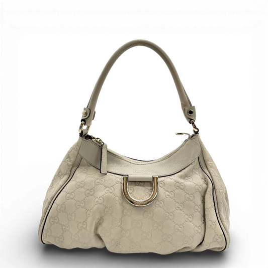 https://cdn.shopify.com/s/files/1/0564/9376/8855/files/Gucci_Schultertasche_D-Ring_aus_Leder_monogram_beige_vintage_GG_1400.webp?v=1771504355