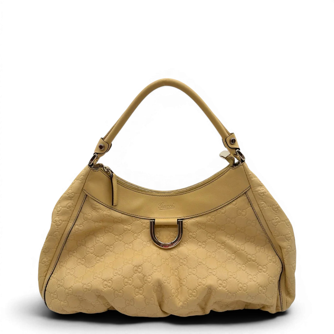 https://cdn.shopify.com/s/files/1/0564/9376/8855/files/Gucci_Schultertasche_D-Ring_large_aus_Leder_monogram_gelb_1.webp?v=1784281400