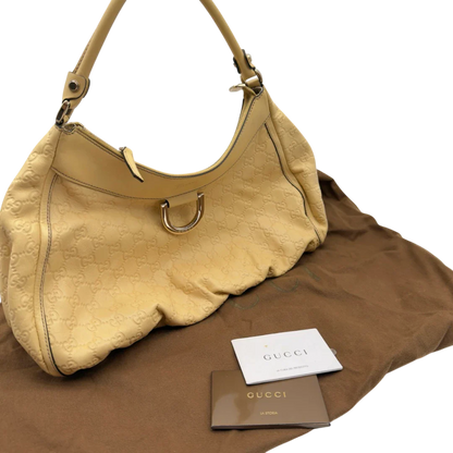 https://cdn.shopify.com/s/files/1/0564/9376/8855/files/Gucci_Schultertasche_D-Ring_large_aus_Leder_monogram_gelb_22.webp?v=1784281400