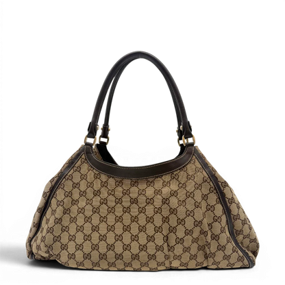 https://cdn.shopify.com/s/files/1/0564/9376/8855/files/Gucci_Schultertasche_D-Ring_large_monogram_beige_vintage_GG6964.webp?v=1779289890