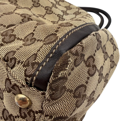 https://cdn.shopify.com/s/files/1/0564/9376/8855/files/Gucci_Schultertasche_D-Ring_large_monogram_beige_vintage_GG6968.webp?v=1779289890