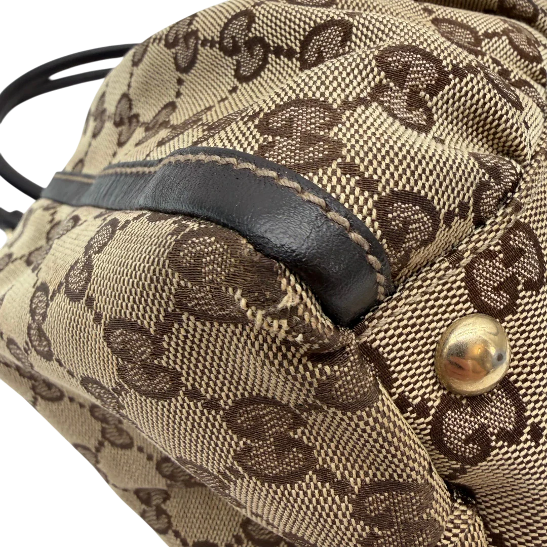 https://cdn.shopify.com/s/files/1/0564/9376/8855/files/Gucci_Schultertasche_D-Ring_large_monogram_beige_vintage_GG6969.webp?v=1779289890