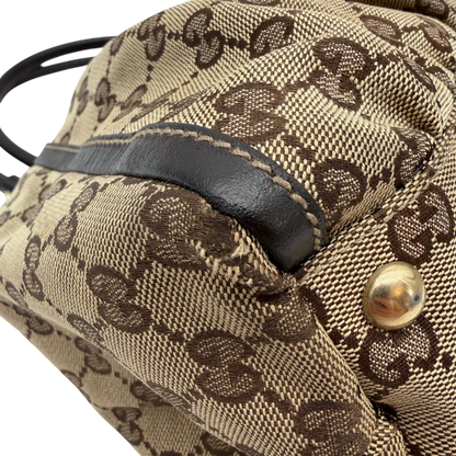 https://cdn.shopify.com/s/files/1/0564/9376/8855/files/Gucci_Schultertasche_D-Ring_large_monogram_beige_vintage_GG6969.webp?v=1779289890