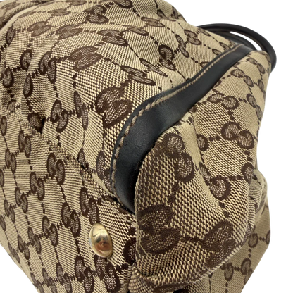 https://cdn.shopify.com/s/files/1/0564/9376/8855/files/Gucci_Schultertasche_D-Ring_large_monogram_beige_vintage_GG6970.webp?v=1779289890