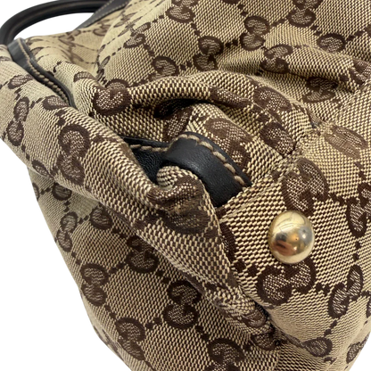 https://cdn.shopify.com/s/files/1/0564/9376/8855/files/Gucci_Schultertasche_D-Ring_large_monogram_beige_vintage_GG6971.webp?v=1779289890