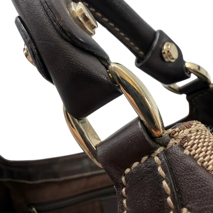 https://cdn.shopify.com/s/files/1/0564/9376/8855/files/Gucci_Schultertasche_D-Ring_large_monogram_beige_vintage_GG6973.webp?v=1779289889