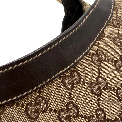 https://cdn.shopify.com/s/files/1/0564/9376/8855/files/Gucci_Schultertasche_D-Ring_large_monogram_beige_vintage_GG6974.webp?v=1779289890