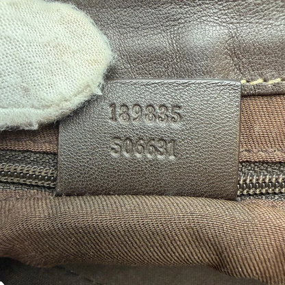 https://cdn.shopify.com/s/files/1/0564/9376/8855/files/Gucci_Schultertasche_D-Ring_large_monogram_beige_vintage_GG6978.webp?v=1779289890