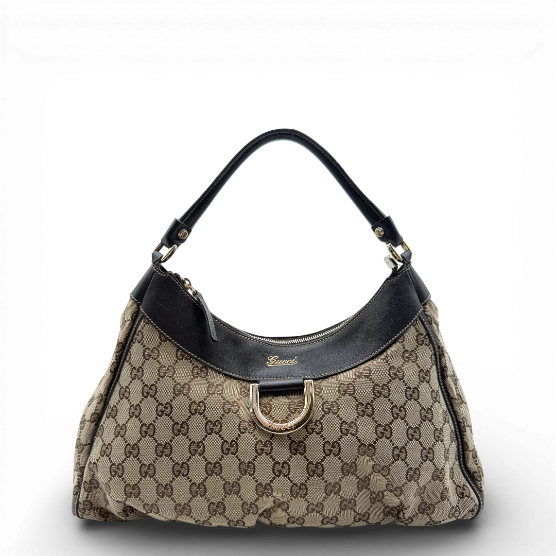 https://cdn.shopify.com/s/files/1/0564/9376/8855/files/Gucci_Schultertasche_D-Ring_large_monogram_beige_vintage_GG_0712.webp?v=1772111312