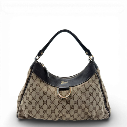 https://cdn.shopify.com/s/files/1/0564/9376/8855/files/Gucci_Schultertasche_D-Ring_large_monogram_beige_vintage_GG_0712.webp?v=1772111312