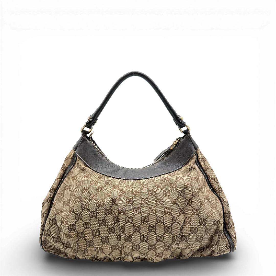 https://cdn.shopify.com/s/files/1/0564/9376/8855/files/Gucci_Schultertasche_D-Ring_large_monogram_beige_vintage_GG_0715.webp?v=1772111450