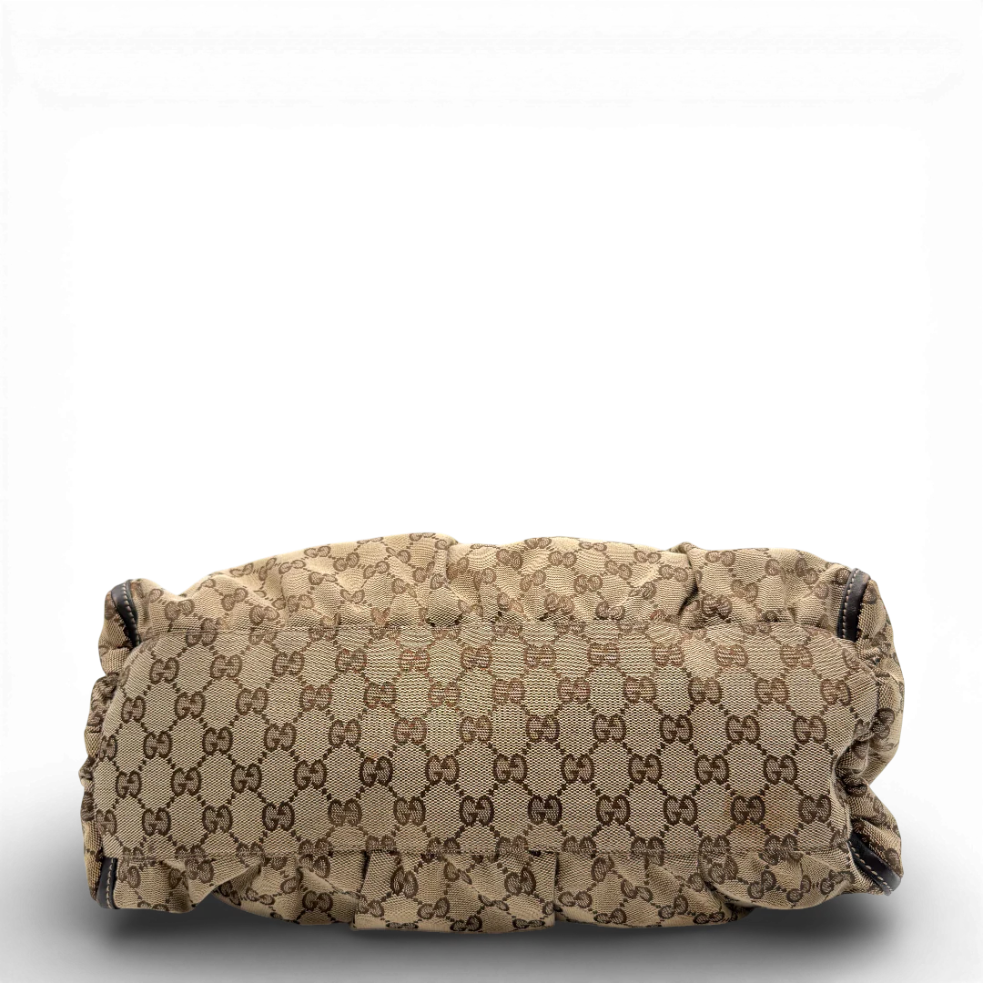 https://cdn.shopify.com/s/files/1/0564/9376/8855/files/Gucci_Schultertasche_D-Ring_large_monogram_beige_vintage_GG_0721.webp?v=1772111450