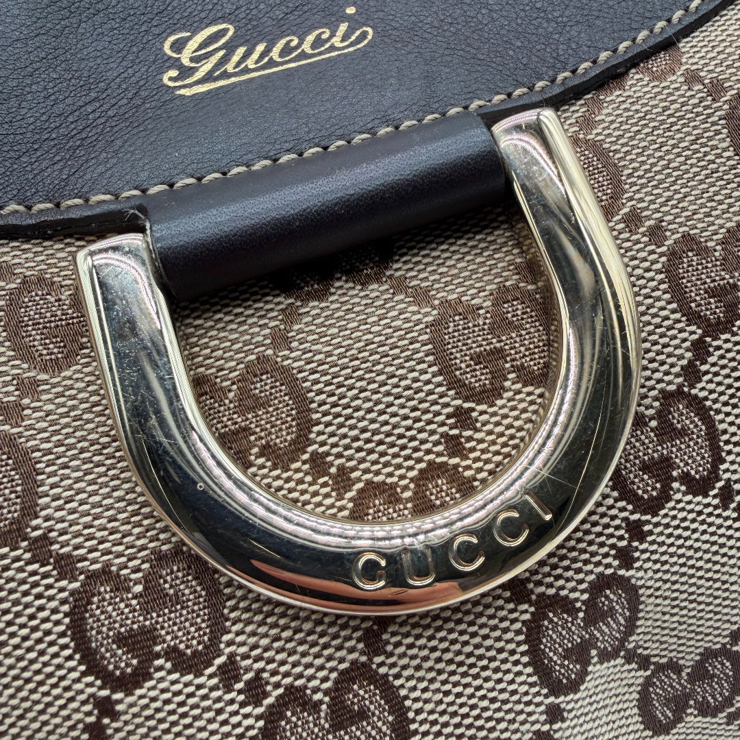 https://cdn.shopify.com/s/files/1/0564/9376/8855/files/Gucci_Schultertasche_D-Ring_large_monogram_beige_vintage_GG_0728.webp?v=1772111450