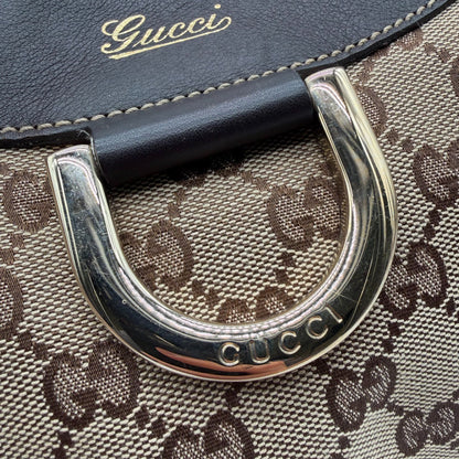 https://cdn.shopify.com/s/files/1/0564/9376/8855/files/Gucci_Schultertasche_D-Ring_large_monogram_beige_vintage_GG_0728.webp?v=1772111450