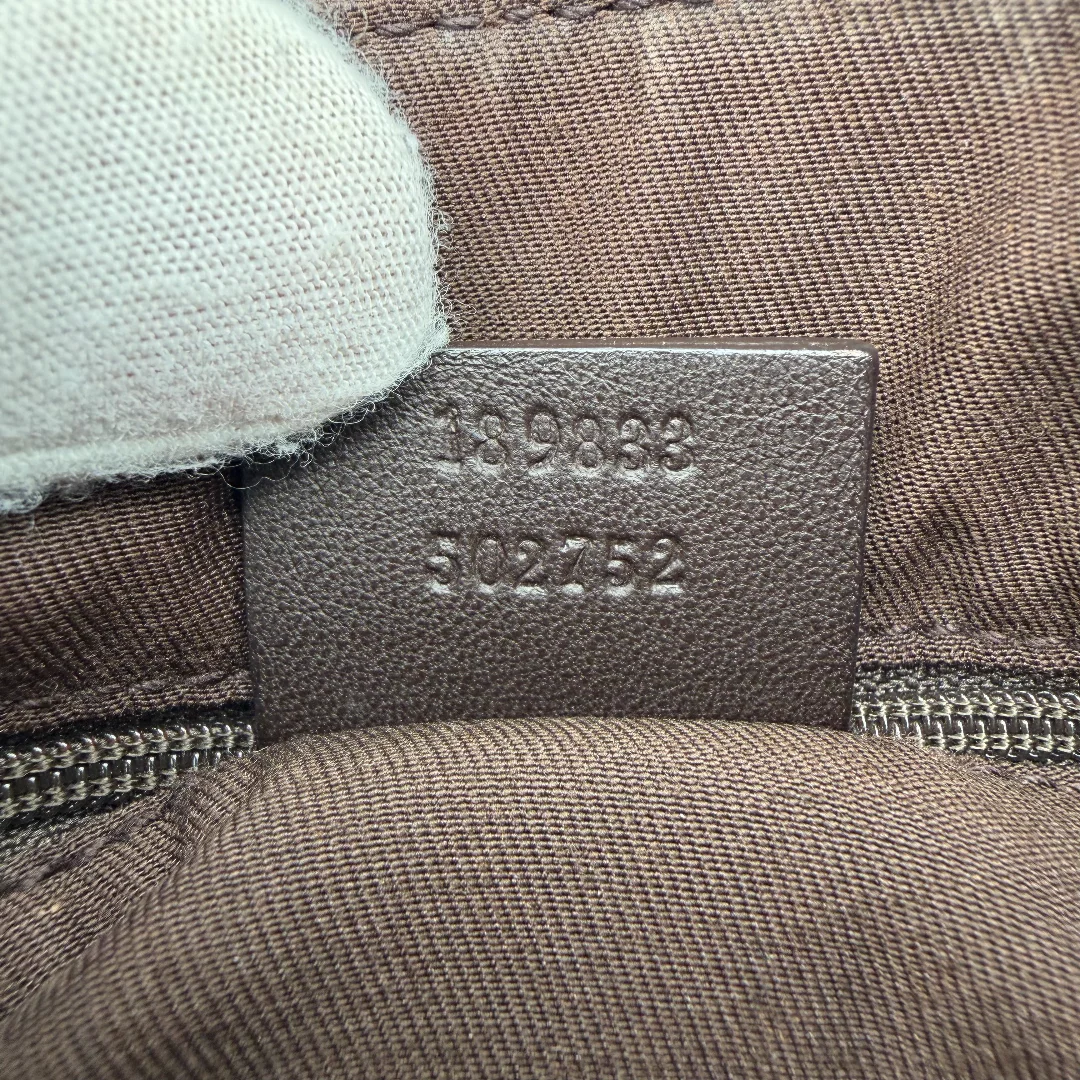 https://cdn.shopify.com/s/files/1/0564/9376/8855/files/Gucci_Schultertasche_D-Ring_large_monogram_beige_vintage_GG_0733.webp?v=1772111450